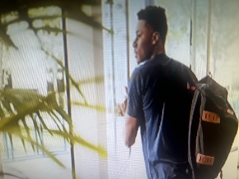 Earlier website picture of a student wearing a backpack