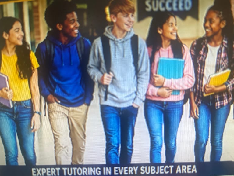 Earlier website picture of a diverse group of students with books and backpacks